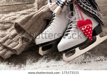 White ice skates on old wooden boards