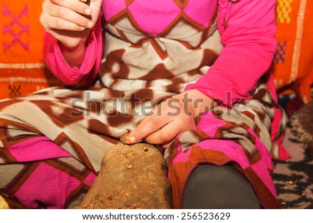 argan oil processing by hand by women used in cosmetics and food morocco