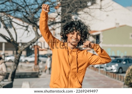 Similar – Image, Stock Photo Ethnic teenage boy with Down syndrome browsing laptop at home