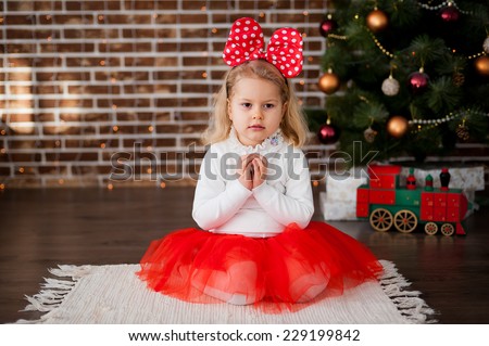 Girl in Christmas costumes with rabbit