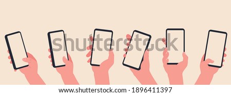 Hand hold a phone with blank screen. Hands interaction on  touchscreen device. Online learning and shopping concept.