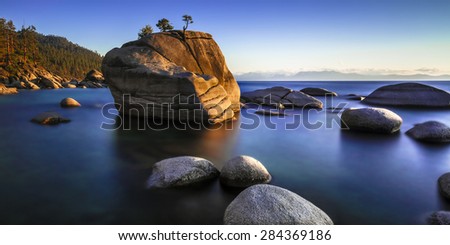 Bonsai Rock, Lake Tahoe, Nevada.  Smooth water and late evening light.