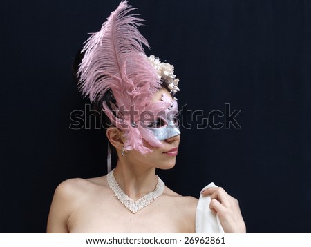 Lady in fancy mask with pink feather on black