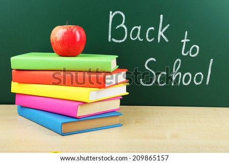 Books and blackboard. Back to school.