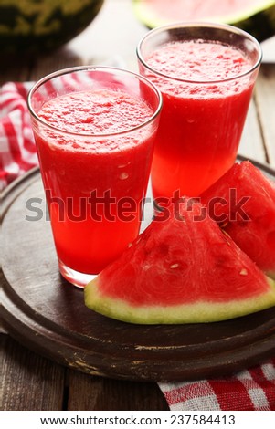 Watermelon smoothies on brown wooden background