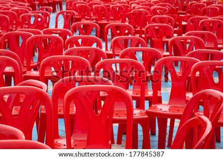 Pattern red plastic chair background.