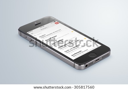 Varna, Bulgaria - May 31, 2015. Google Gmail app logo on the black Apple iPhone 5s display that lies on the surface. Gmail is a free e-mail service provided by Google. Isolated on white background.