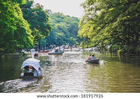 TOKYO, JAPAN - MAY 21: Japanese people are paddling a boat with their family at Inokashira park in the rainy season on May 21, 2011 in Tokyo, Japan.