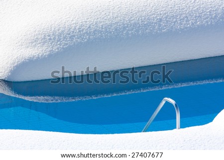 A pool in winter with snow.