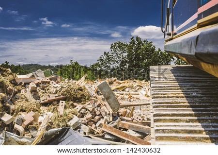 An existing structure is demolished on a future construction site