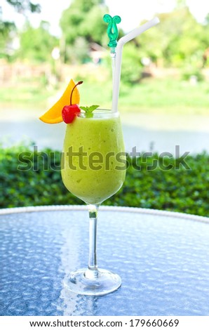 green tea smoothie mix fruit on table