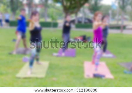 blurred woman fitness group - yoga team