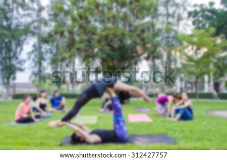 blurred woman fitness group - yoga team