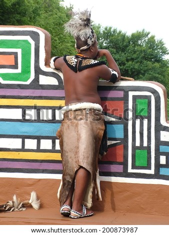 SHAKALAND, SOUTH AFRICA - CIRCA NOVEMBER 2011: Unidentified Zulu man wearing traditional Zulu warrior clothing at Shakaland Zulu Cultural Village, KwaZulu-Natal, South Africa