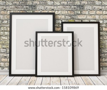 3d of three blank black picture frames on the old brick wall and the wooden floor, background