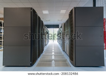 Different servers and disk arrays arranged in racks in the computer room