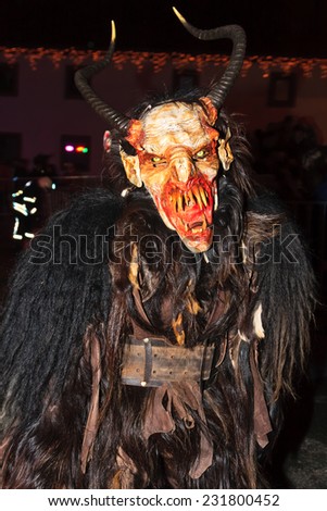 PODKOREN, SLOVENIJA - NOVEMBER 29th: Unidentified man wears Krampus (devil) mask at traditional procession on November 29th 2013 
