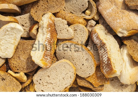 Many slices of stale bread and other stale baked goods.