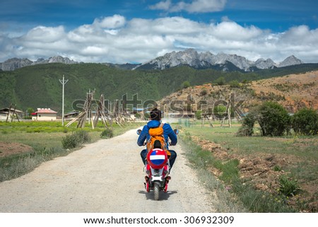 A man rent bicycle riding on road to Shangri-La