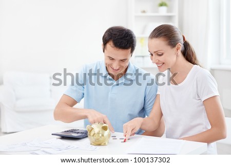 Young couple counts money
