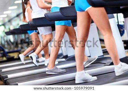 Human foot on the treadmill closeup