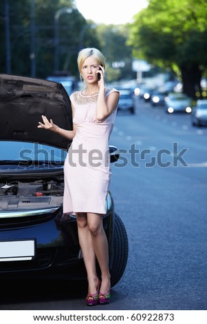 The girl in the broken car on the phone