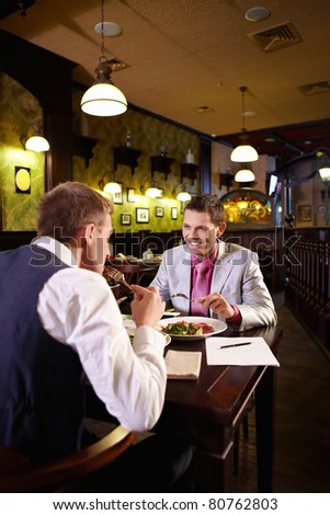Two men having lunch in a restaurant