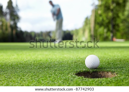 Golfer drove the ball into the hole