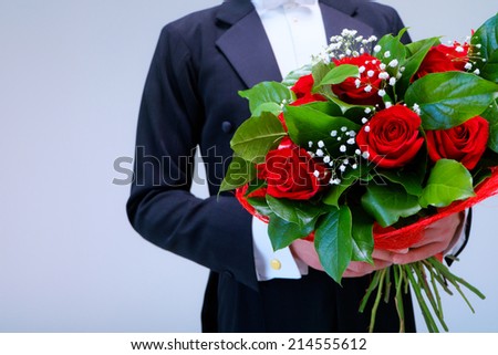 Man in a tuxedo with a bouquet