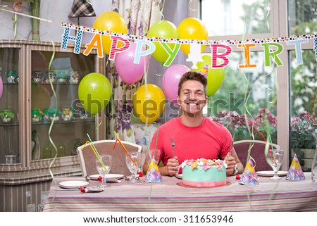 Joyful man at a birthday party