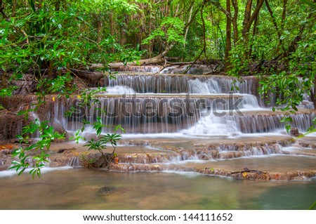 Waterfall in deep rain forest jungle. (Huay Mae Kamin Waterfall in Kanchanaburi Province, Thailand)