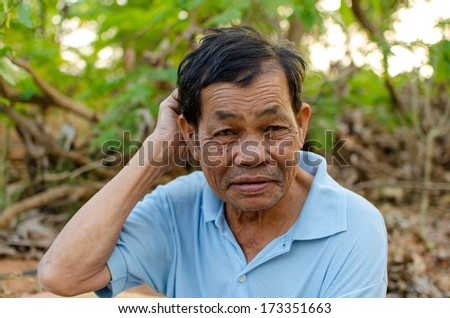 portrait of laughing old man  with interesting gestures.