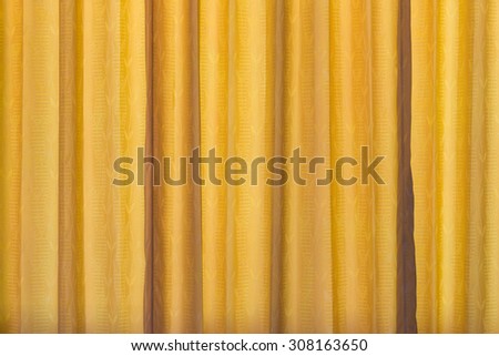 yellow curtain fabric texture for background.