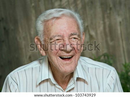 Laughing 90 year old senior man candid portrait