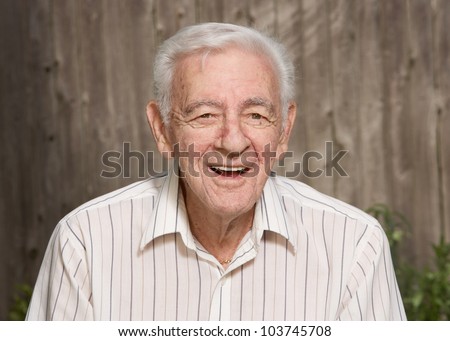 Happy handsome smiling old elder senior man