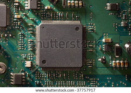 Green circuit board background closeup with dramatic lighting
