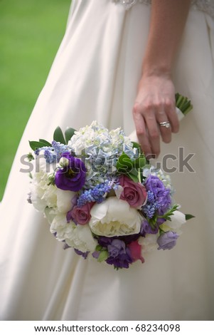 Wedding bouquet flowers in hand of bride