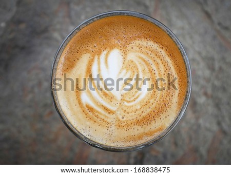 Fresh latte coffee cup art swirl
