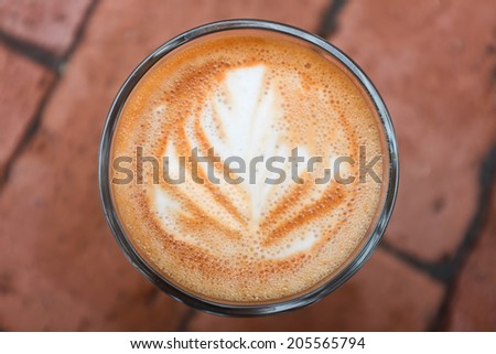 Latte or cappuccino coffee cup art swirl