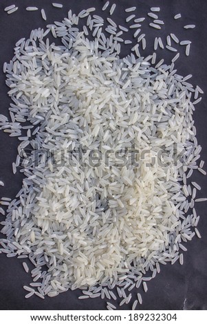 Heap of rice on a black background.