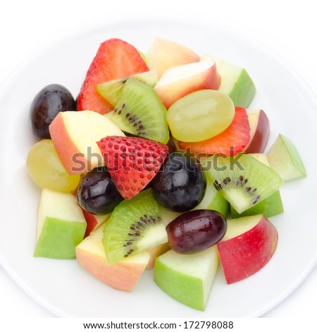 Fruits salad with strawberries, grapes, kiwis and apples