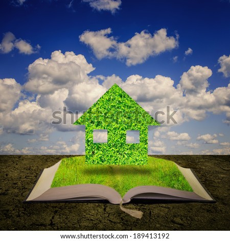 Open book with green house coming out of its pages, ecology concept.