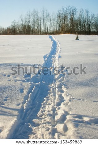 Footpath on the snow-covered field