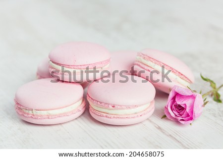 Pastel pink macaroons with rose, pastel colored, selective focus