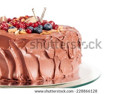Chocolate mousse cake with berries isolated on white