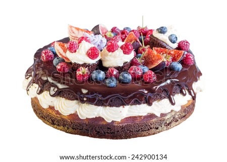 Layered chocolate cake decorated with cream and fruit isolated on white