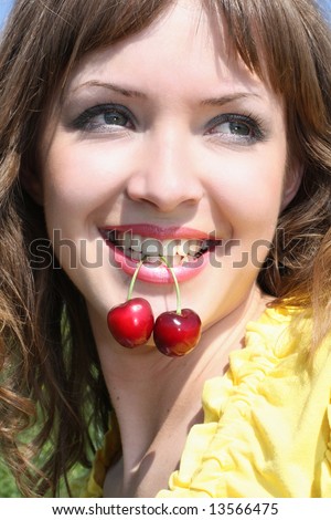 Happy woman with cherry