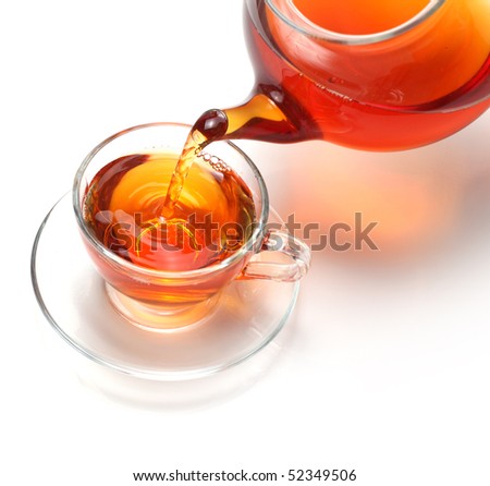 pouring tea to a teacup