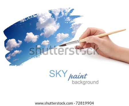 hand with brush and sky paint