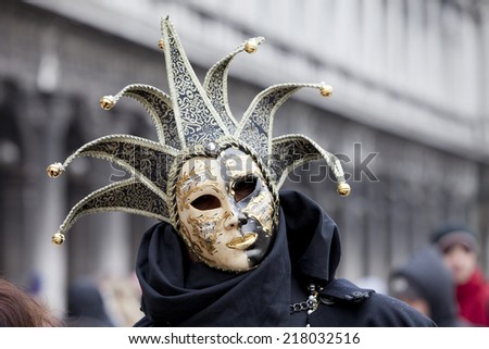 Venice, Italy - February 11 2012: Woman with typical venetian carnival costume at the Carnival of Venice. Shot in St. Mark's Square.